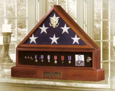 The Presidential Pedestal Urn Flag & Medal Display Case is a beautiful urn in a Walnut or Cherry finish and is crafted in the USA.